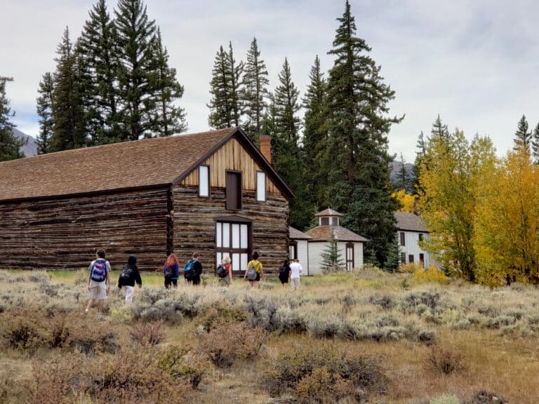 A Group of students in front a cabin