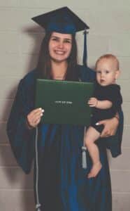 Young lady - GOAL High School graduate with baby and diploma. 