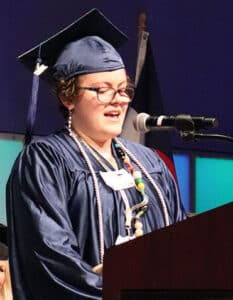 Issac making a speech at graduation