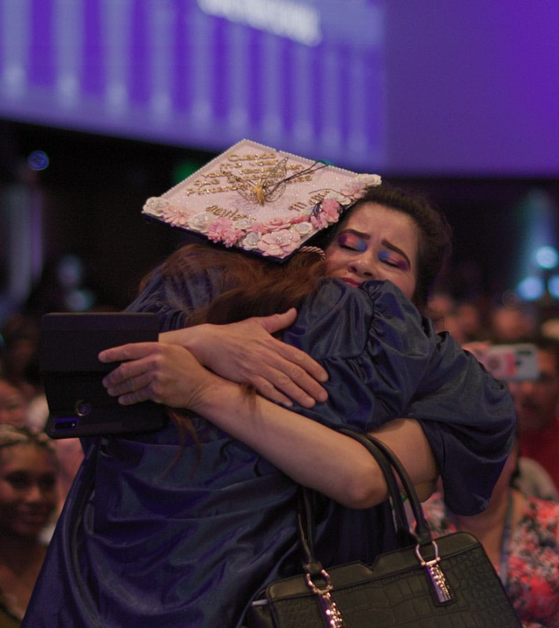 Parent Hugging Their Graduate