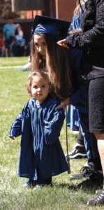 GOAL Graduate and baby girl in graduation gown